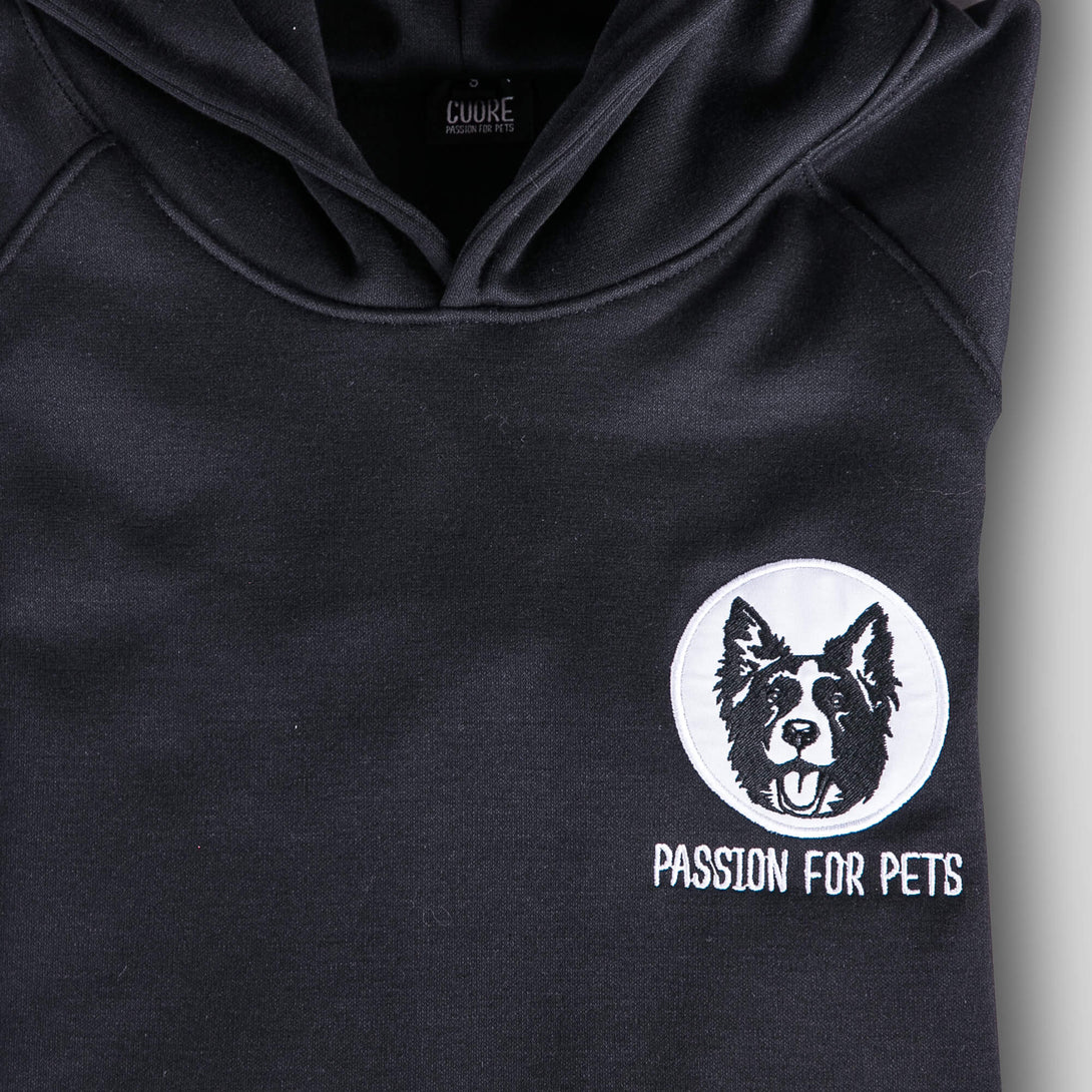 Buzo negro unisex con bordado de Border Collie blanco